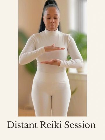 Woman practicing distant Reiki healing with hands positioned for energy flow.