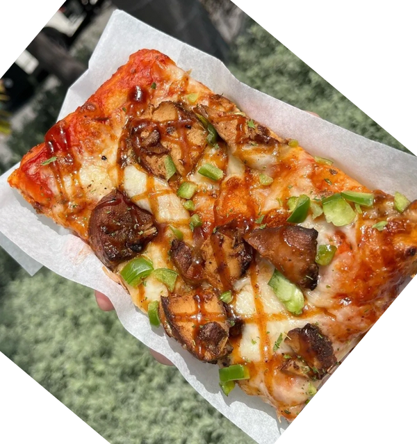 A slice of bbq barbecue chicken pizza from Pizza Please, Italian Jamaican restaurant in Kingston Jam