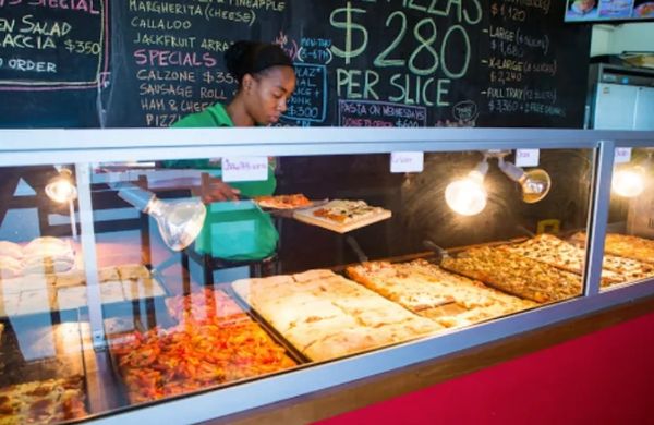 Our counter is full of beautiful pizzas! Choose your favorite and order as many slices as you wish!