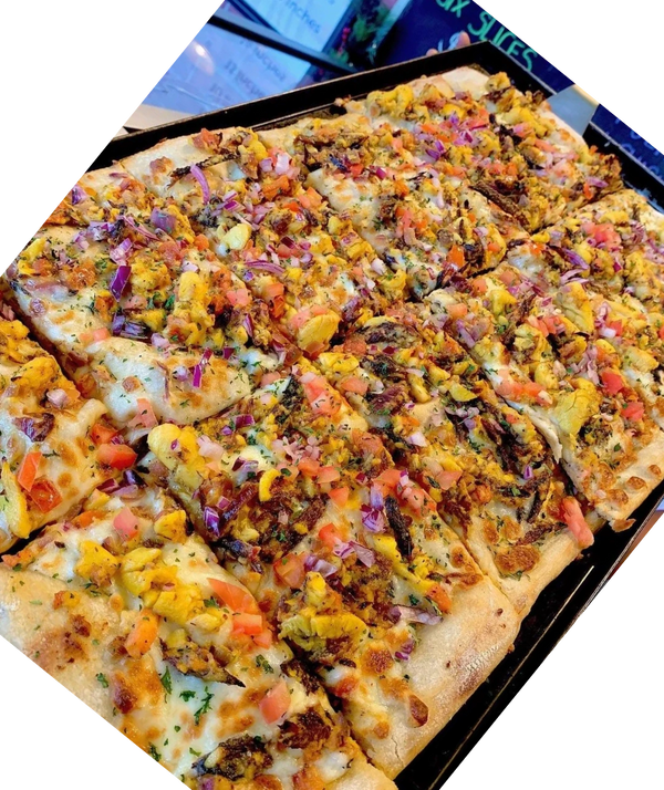 ackee and red herring pizza is a classic jamaican topping specialty pizza!