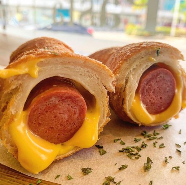 The sausage roll is a chicken sausage, wrapped in american cheese and pizza dough, then deep fried! 