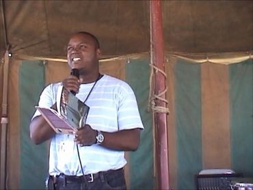 Reading poems at the African Marketplace, 2006