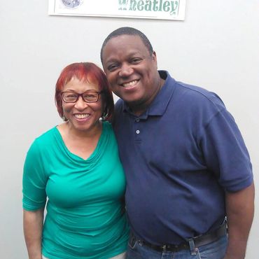 Charles poses with Rose Mitchell, former Black Resource Center custodian for the AC Bilbrew Library.