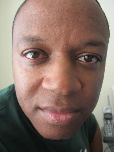 Close-up of a man's face with a calm expression.