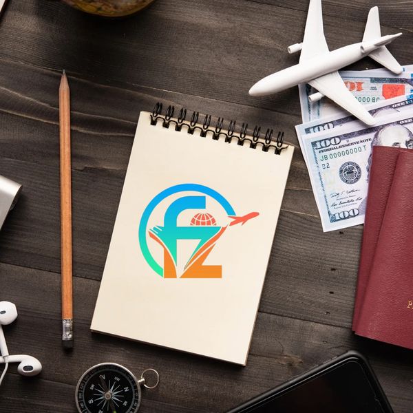 Travel essentials including a notebook, passport, money, and a toy airplane on a wooden desk.