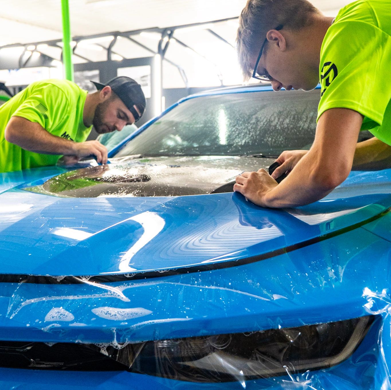 Paint protection film installed on a bright blue chevrolet camaro LZ1 to protect from rock chips