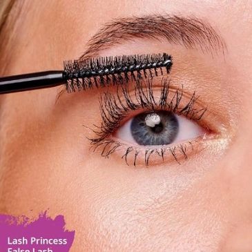 Close-up of applying mascara to eyelashes for a fuller look.