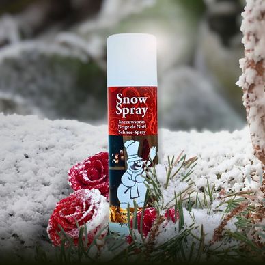 A can of Spring Snow Spray with evergreen branches covered in a white frosted snow effect.