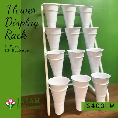 A 4-tier white metal flower display rack holding plastic buckets to keep and hydrate fresh blooms.