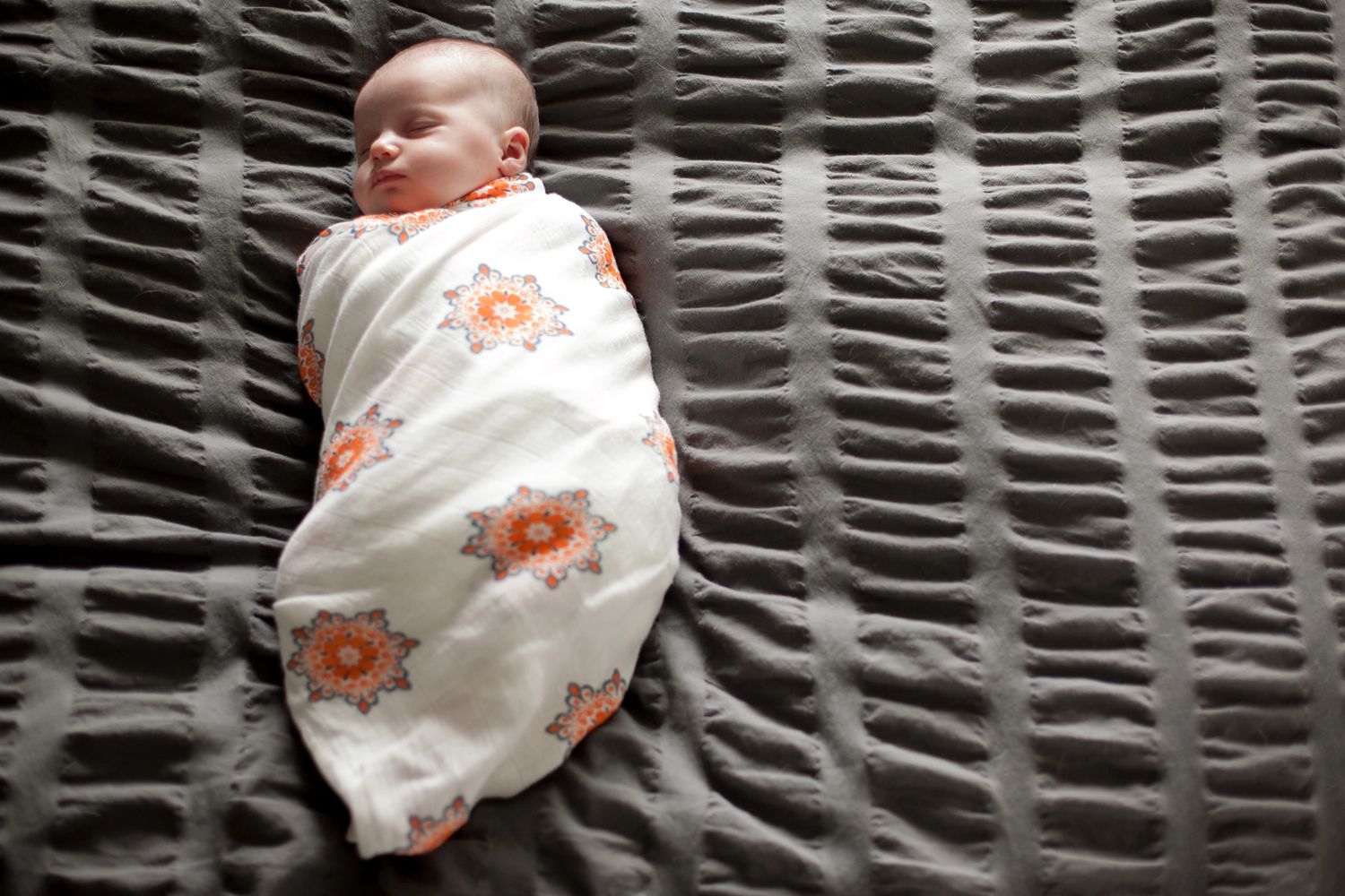 Baby sleeping soundly. Wrapped by postpartum doula.
