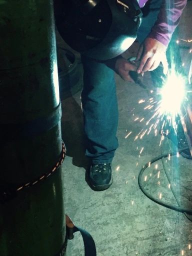 Carlos  welding a framework together