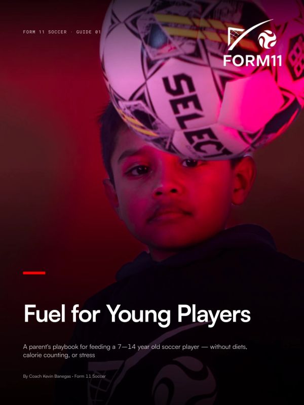 Young boy focused on a soccer ball with Form11 logo.