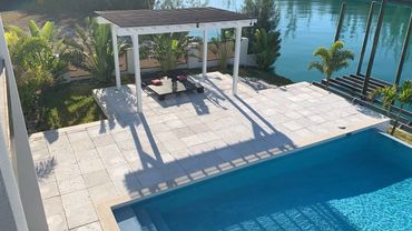 Pool deck and waterfront view