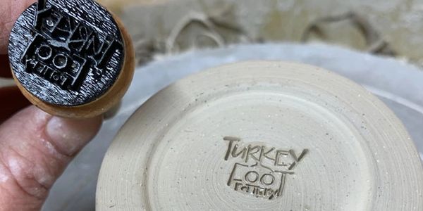 photo of signature stamp used for turkey foot pottery