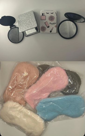 Various compact mirrors and colorful fluffy sleep masks on a table.