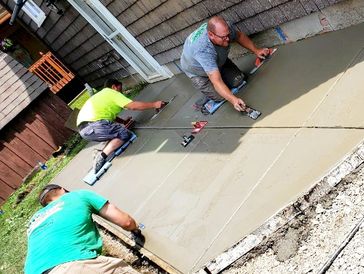 Yard Wolves Landscaping crew working on traditional concrete