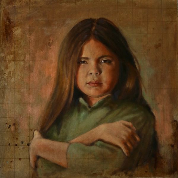 Portrait of a girl with long hair crossing her arms.