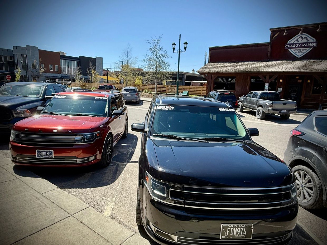 Good Vibe Rides Black & Red Ford Flex SUV’s for a local taxi pick up in Whitefish