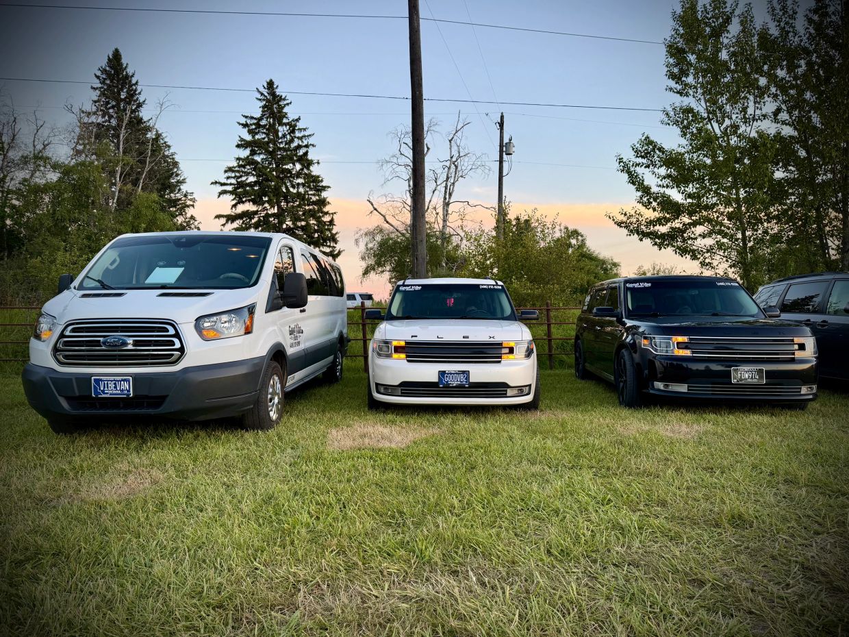 Good Vibe Rides VIBEVAN along with the White and Black Ford Flex SUV’s staged at the Under The Big S