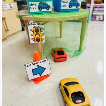image of a car wash dramatic play center set up in a preschool or kindergarten classroom