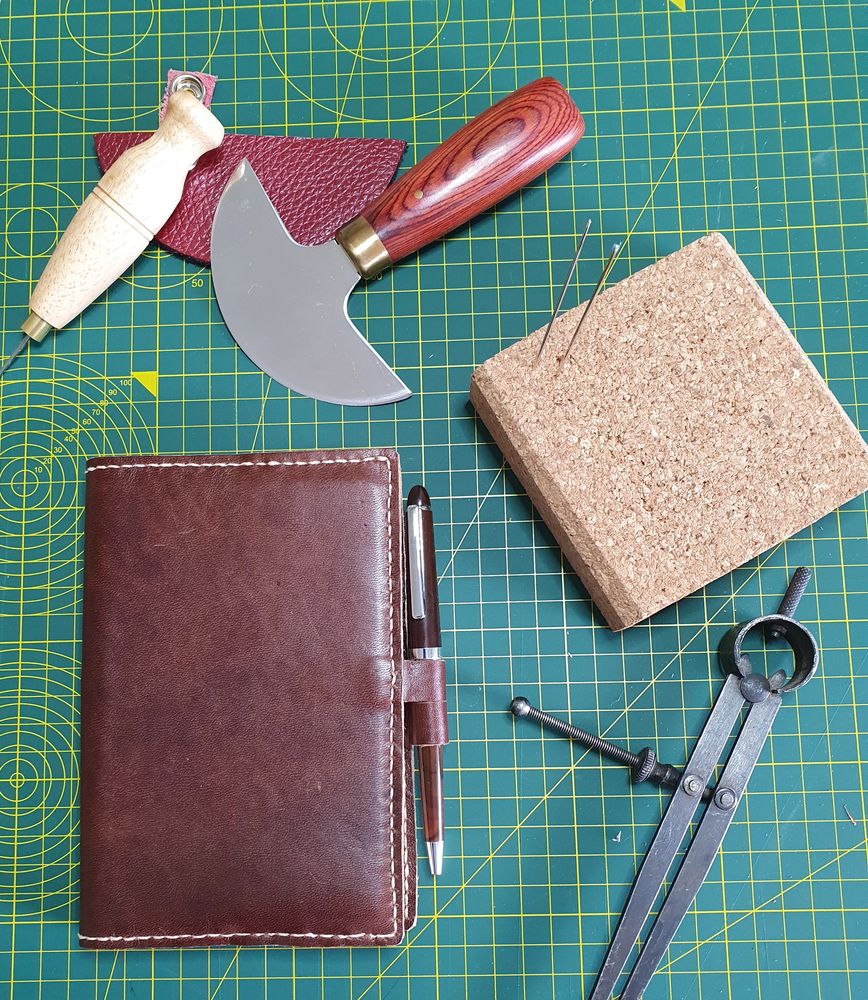 This A6 sized dark brown Horween leather journal is hand cut and hand stitched with inner pokets to 