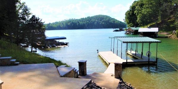 The covered dock has dockage for 2 boats and other water toys including jet skis, kayaks.  