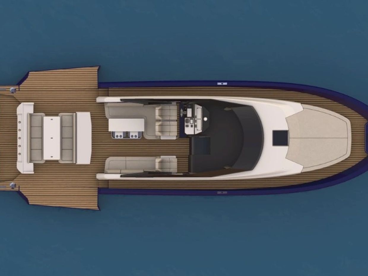 Top view of a sleek motorboat with four engines and spacious seating areas.