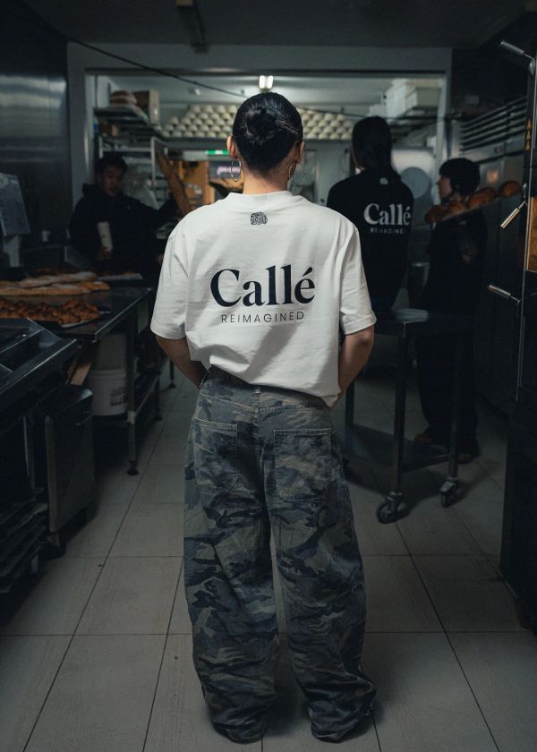 Calle Reimagined Apparel. White Tshirt shown.