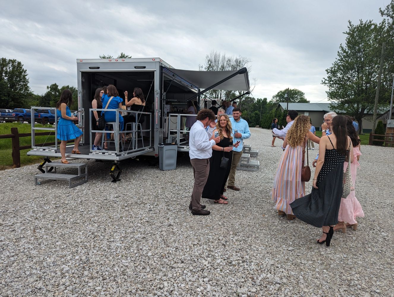 Hitched Venues expandable mobile bar trailer at an outdoor event
