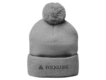 Image of a grey knit cap with a pom-pom top portraying comfort for the brisk and cold days