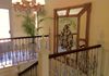 Mallorca villa renovated staircase, with bespoke carved heraldic mirror