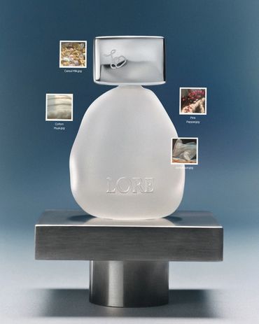 Sculptural perfume bottle with material samples.