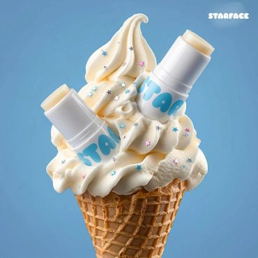 Ice cream cone topped with two chapsticks and star-shaped sprinkles.