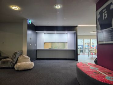 Empty modern lounge area with bean bag and seating.