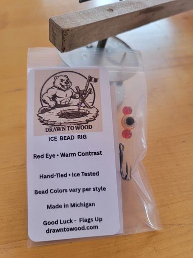 Hand-tied ice fishing bead rig with red eye and warm contrast beads, made in Michigan.