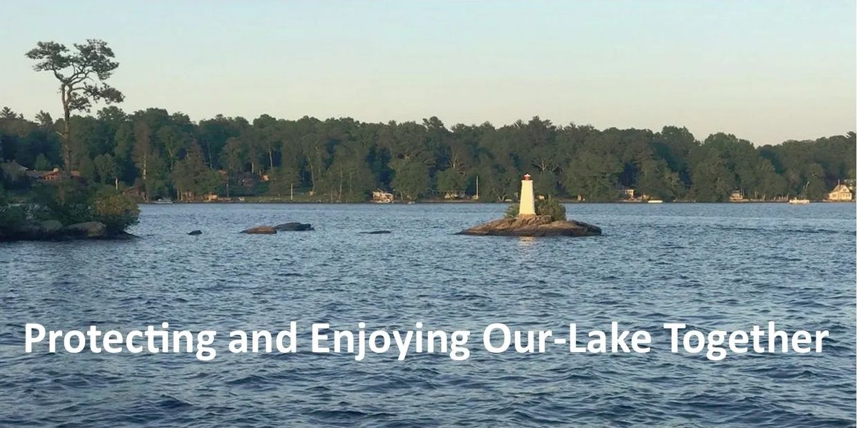 A serene lake with a small lighthouse on a rocky islet and text about protecting the lake.
