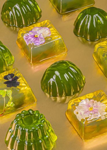 Green and yellow gelatin with embedded flowers.