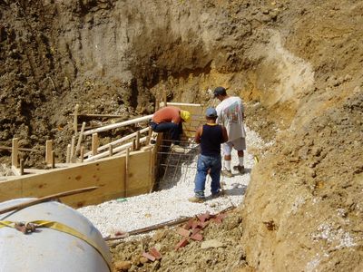 three people working on the site