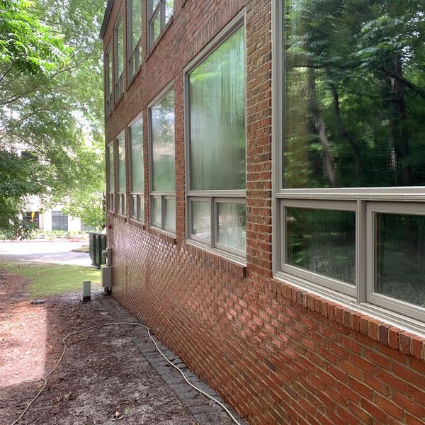 Soft-washing service on a Brick Commercial Building in Atlanta