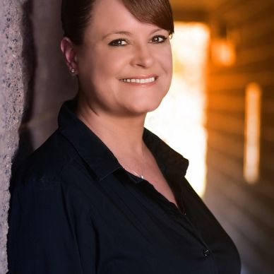 Woman smiling in black shirt