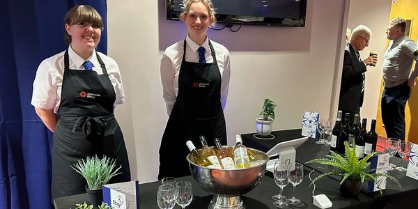 Staff and wine table for a dinner