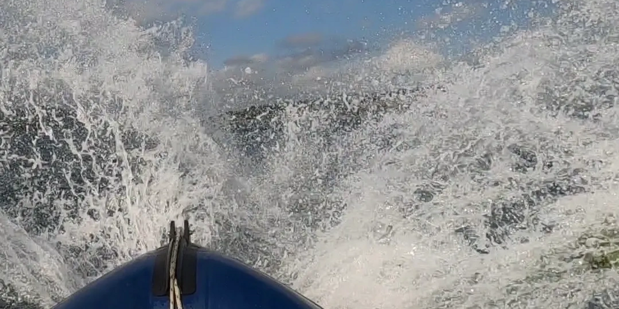 Image: RIB bow with spray in Falmouth Bay