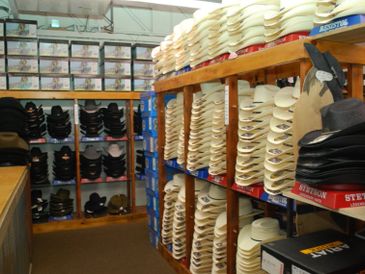 Shelves stocked with cowboy hats.