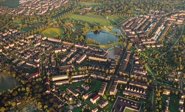 Aerial view of a suburban neighborhood with greenery and a pond.