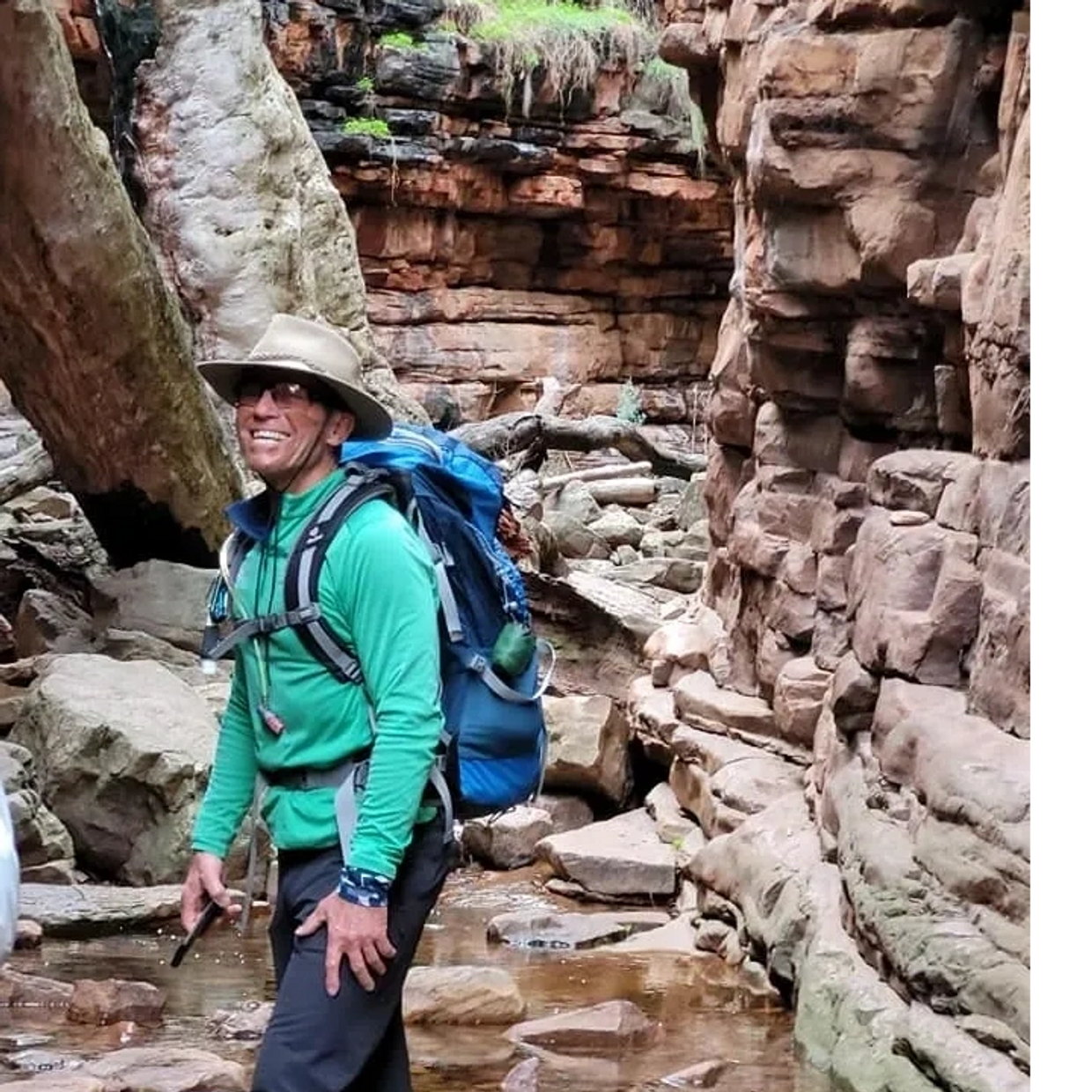 Walker with backpack posing for photo in the Narrows Mt Remarkable National Park