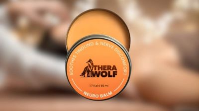 Orange tin of TheraWolf Neuro Balm with lid partially off.