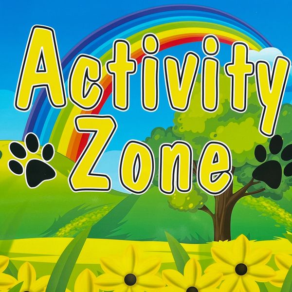 Activity Zone Sign with blue sky, rainbow, trees, yellow flowers.  activity zone written in yellow 