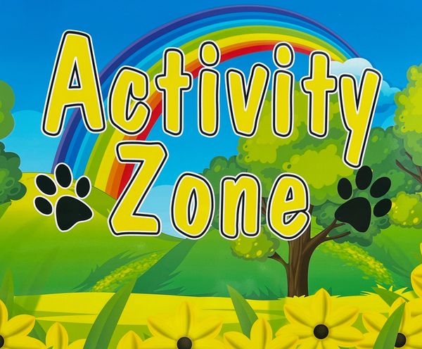 Colorful sign reading 'Activity Zone' with a rainbow and paw prints.