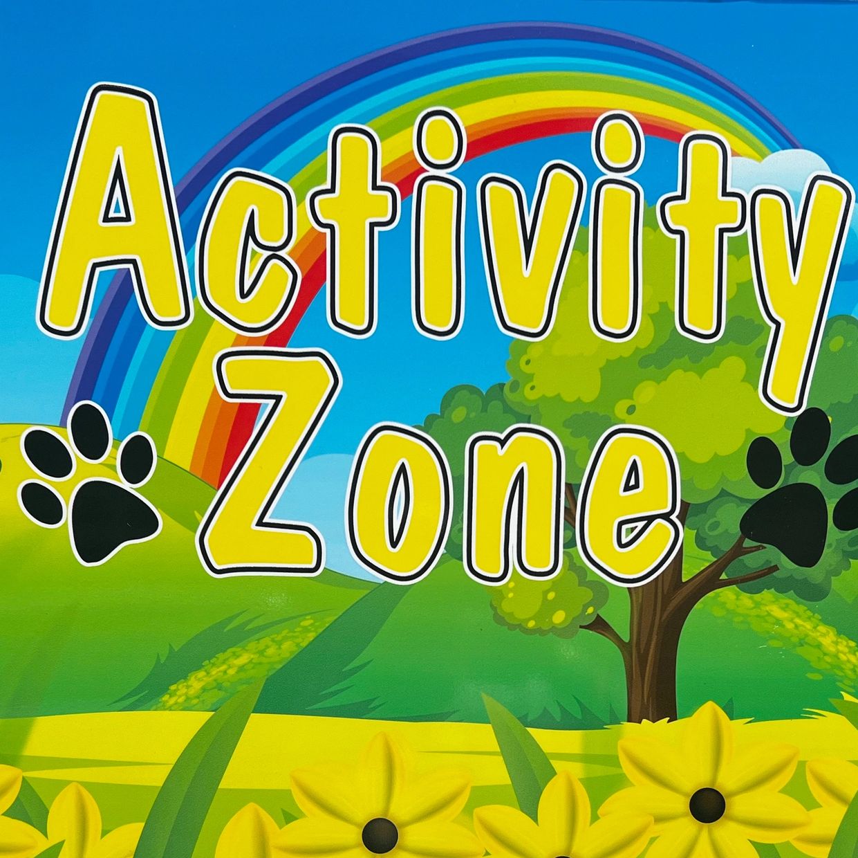 Colorful "Activity Zone" sign with flowers and a rainbow.