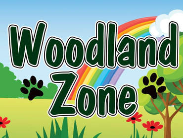 Colorful Woodland Zone sign with rainbow and paw prints.